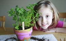 Girl with herbs in painted pots