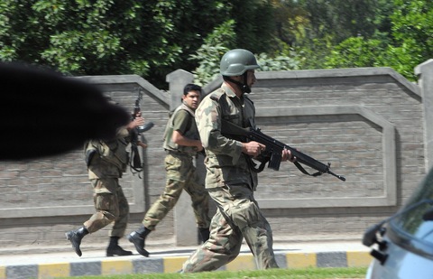 Pakistani soldiers take positions following a bombing near the U.S. consulate.