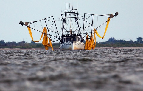 shrimp boat outfitted with booms