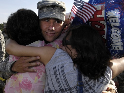 Army SPC Kirk Jones is welcomed by mother Georgia Jones and sister Emily Jones at Fort Stewart, Ga.; Stephen Morton/Getty Images