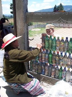 Stacking bottles for the schoolhouse wall. Photo courtesy of Hug It Forward