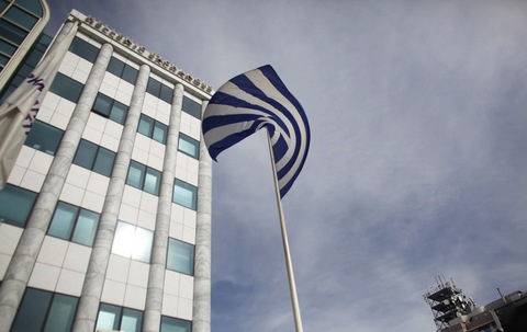 A national flag of Greece flies outside the Greek stock exchange in Athens, Greece, on Monday, Nov. 7, 2011. 