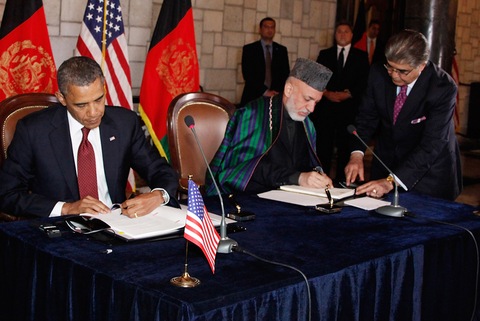 President Obama and Afghan President Hamid Karzai; Afghan Presidential Palace photo via Getty Images