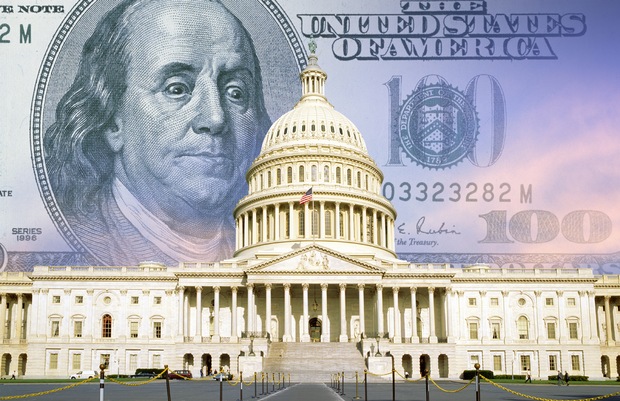 US Capitol with one hundred dollar bill